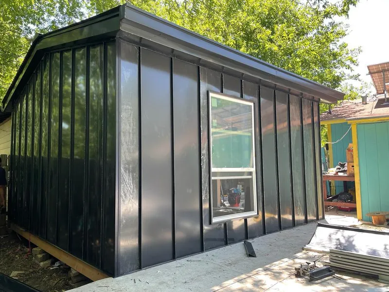 Black standing seam metal wall panels for Roof Inspection in Phelps